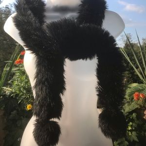Faux fur black scarf with pom poms at bottom